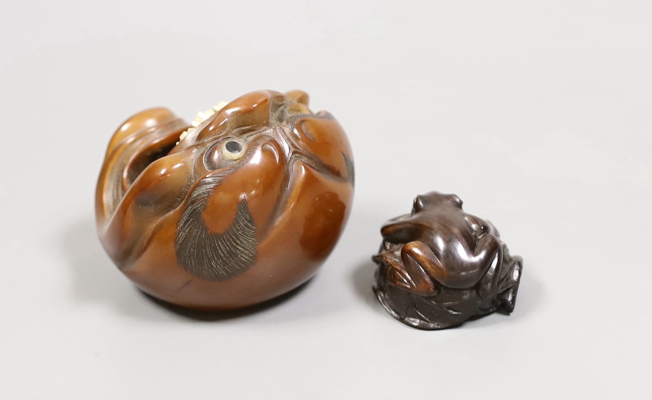 A Japanese mask nut carving wood carving, Meiji period and a netsuke of frogs, marks to bases, largest 7.5cm wide